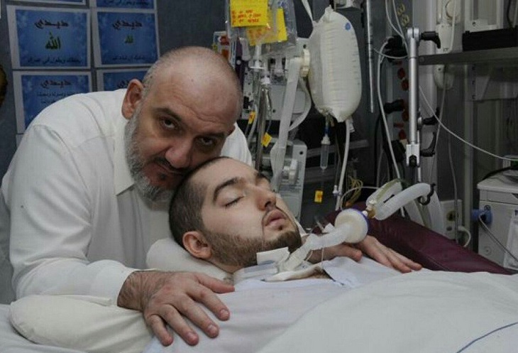 Sleeping Prince Al-Waleed bin Khalid Al Saud lying in hospital bed under medical care