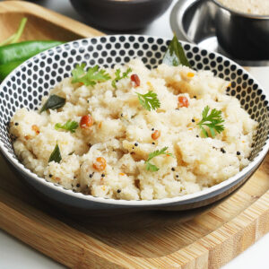 A bowl of hot South Indian style Upma made with suji and garnished with curry leaves