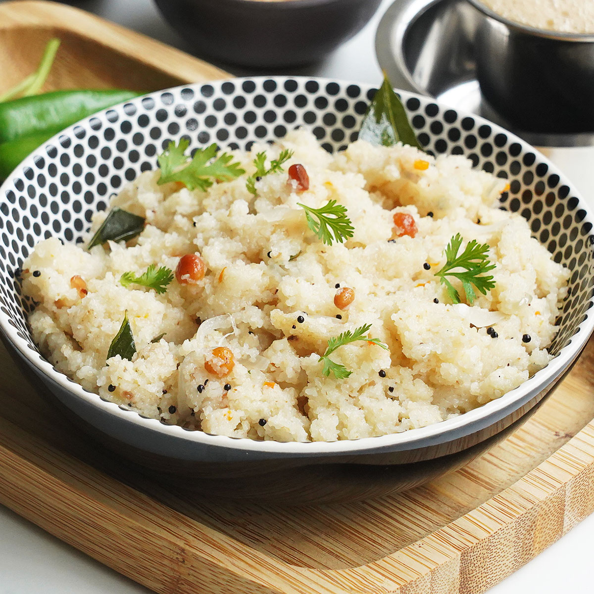 A bowl of hot South Indian style Upma made with suji and garnished with curry leaves